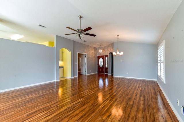 unfurnished living room featuring ceiling fan with notable chandelier, dark hardwood / wood-style floors, and high vaulted ceiling