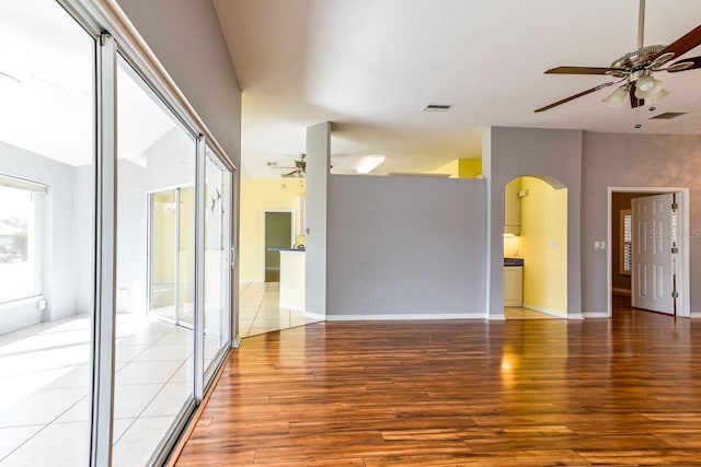 unfurnished room with ceiling fan and hardwood / wood-style flooring