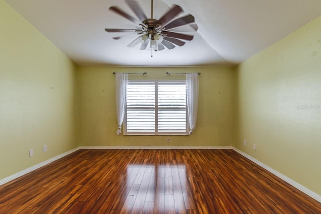 unfurnished room featuring ceiling fan, dark wood-type flooring, and vaulted ceiling