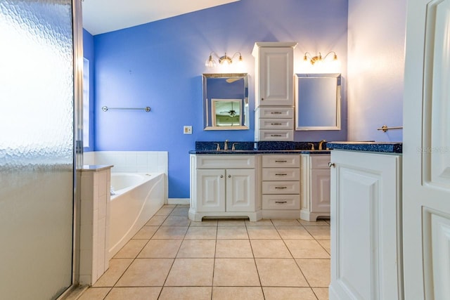 bathroom featuring tile patterned floors, plus walk in shower, and vanity