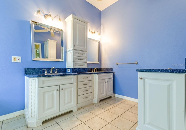 bathroom with tile patterned floors and vanity