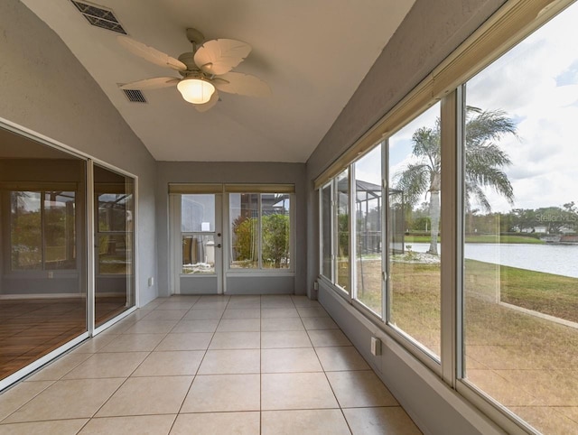 unfurnished sunroom featuring a water view, ceiling fan, and lofted ceiling