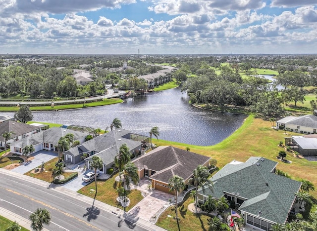 birds eye view of property with a water view