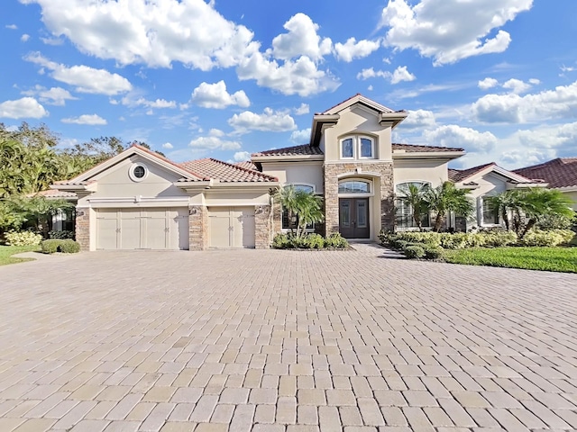 mediterranean / spanish-style home featuring a garage