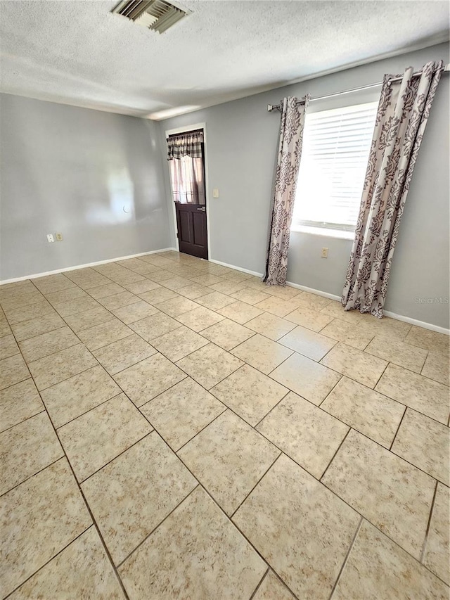 entryway featuring a textured ceiling