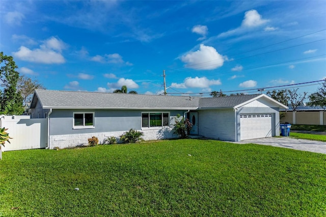 ranch-style home featuring a garage and a front lawn