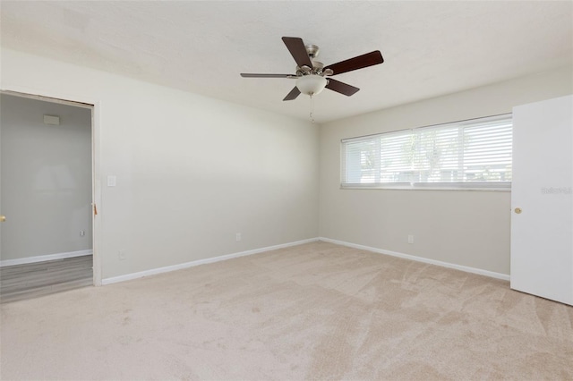 6701 13th Ave N, Saint Petersburg, FL 33710 - spare room featuring a ceiling fan, carpet flooring, and baseboards