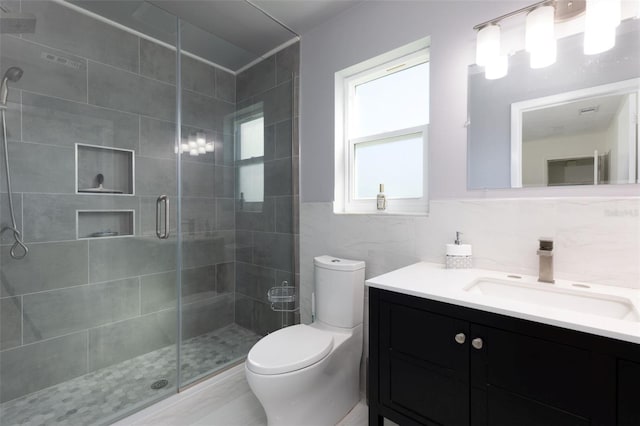 6701 13th Ave N, Saint Petersburg, FL 33710 - full bathroom with tile walls, a stall shower, toilet, and vanity