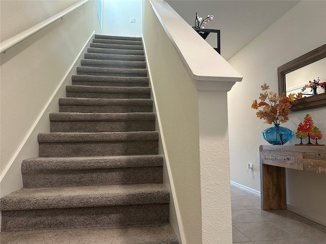 stairway featuring tile patterned floors