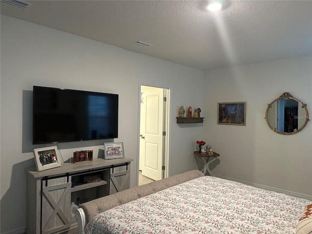 bedroom with a textured ceiling