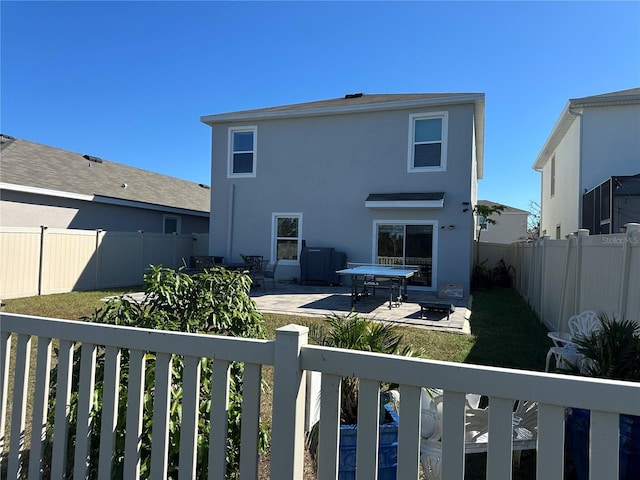 back of house with a patio area