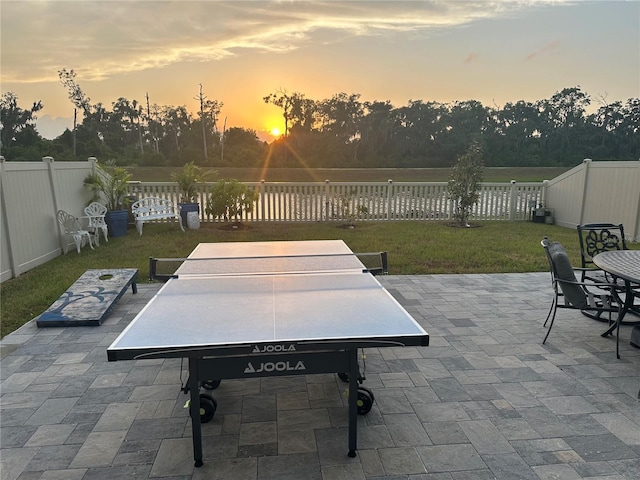 patio terrace at dusk with a yard