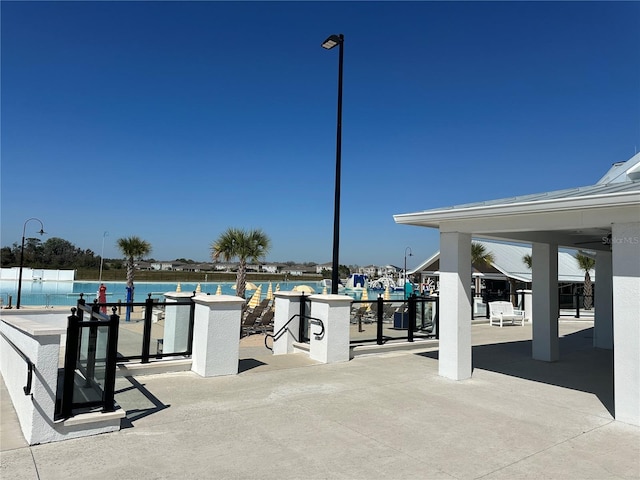 view of patio with a water view