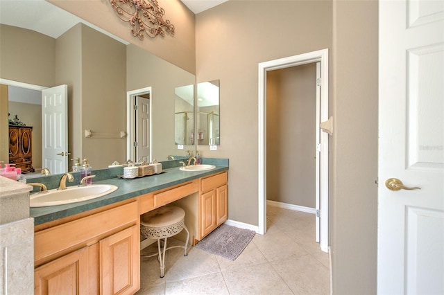 5315 Cedarshake Ln, Valrico, FL 33596 - bathroom featuring tile patterned floors, double vanity, and baseboards