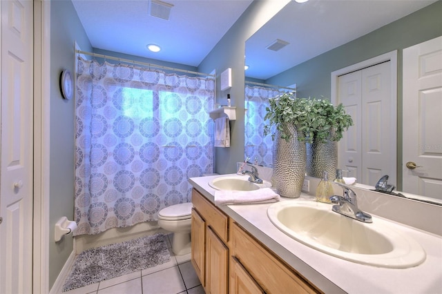 5315 Cedarshake Ln, Valrico, FL 33596 - full bathroom featuring tile patterned flooring, toilet, double vanity, and shower / bath combo