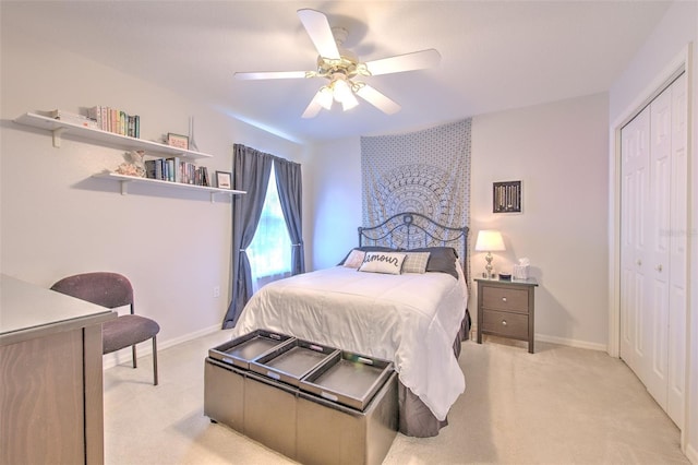 5315 Cedarshake Ln, Valrico, FL 33596 - bedroom with light colored carpet, a closet, ceiling fan, and baseboards