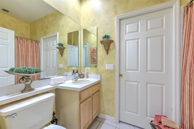 5315 Cedarshake Ln, Valrico, FL 33596 - bathroom with tile patterned floors, vanity, toilet, and a textured wall