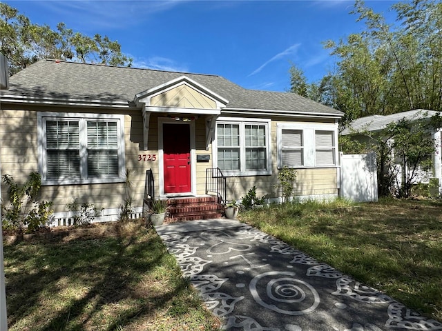 view of front of property with a front lawn