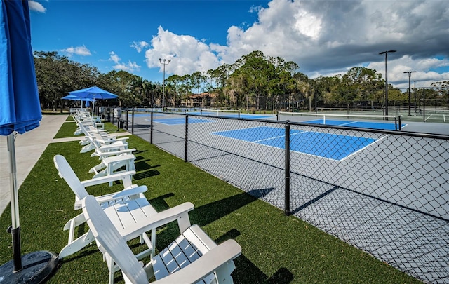 view of sport court with fence