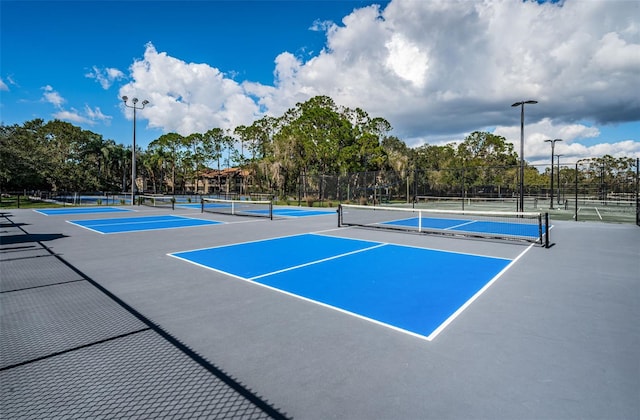 view of sport court with fence