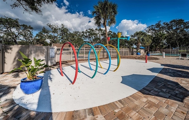 community jungle gym featuring fence