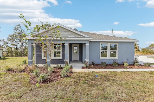 view of front of property with a front lawn