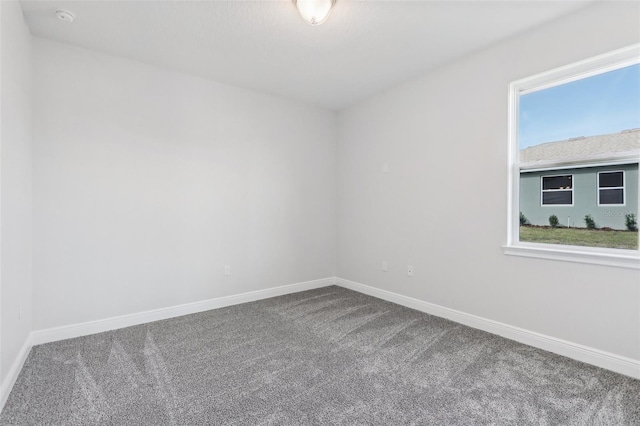 unfurnished room featuring carpet flooring