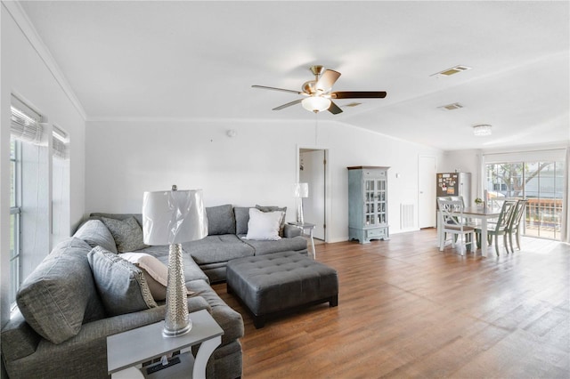 living room with wood-type flooring, ceiling fan, and lofted ceiling