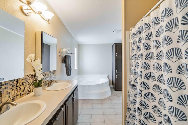 bathroom with tasteful backsplash, tile patterned floors, vanity, and shower with separate bathtub