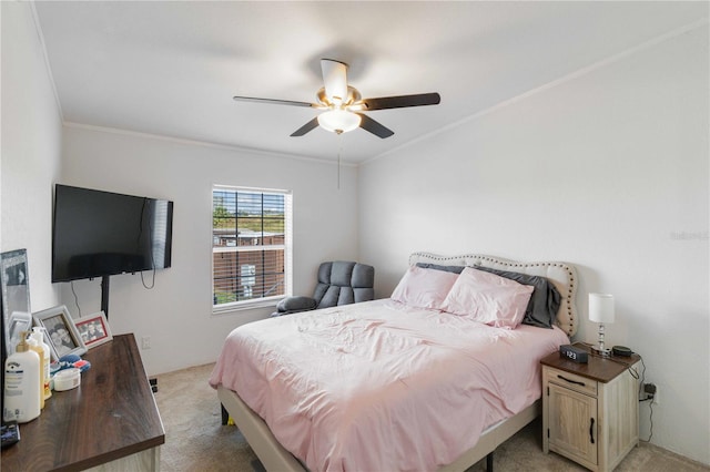 carpeted bedroom with ceiling fan and crown molding