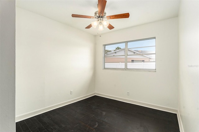 unfurnished room with ceiling fan, baseboards, and dark wood-type flooring