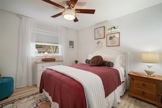 bedroom featuring ceiling fan and light hardwood / wood-style floors