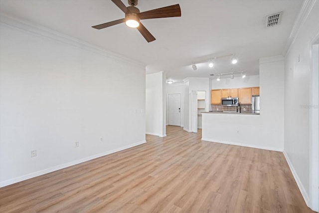 unfurnished living room featuring light hardwood / wood-style flooring, ceiling fan, and crown molding