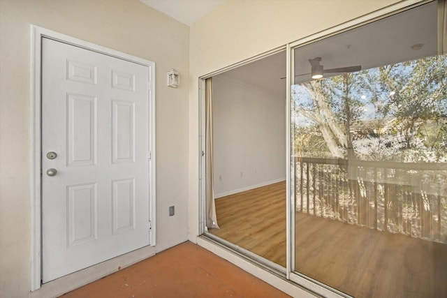 entryway featuring wood-type flooring and ceiling fan