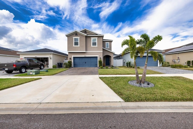 front facade with a garage and a front lawn