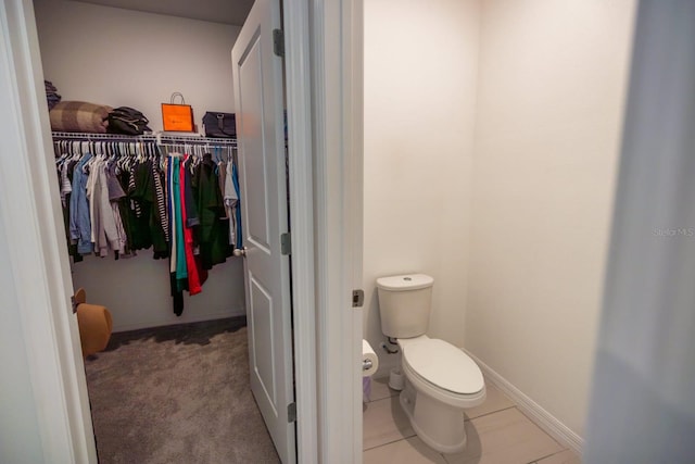 bathroom featuring tile patterned floors and toilet