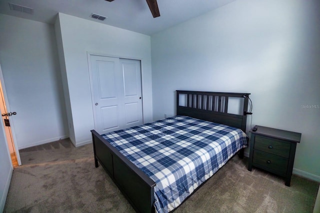 bedroom with ceiling fan, a closet, and dark carpet