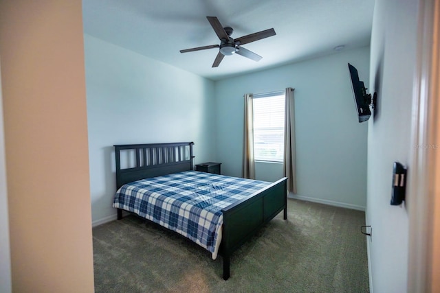 bedroom featuring dark colored carpet and ceiling fan