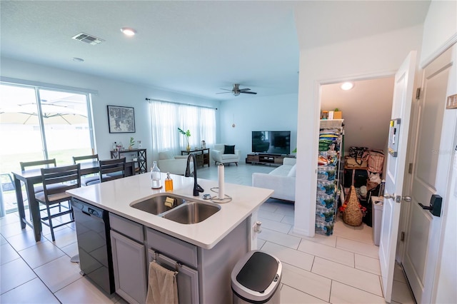 11834 Brighton Knoll Loop, Riverview, FL 33579 - kitchen with black dishwasher, gray cabinetry, a ceiling fan, light countertops, and a kitchen island with sink