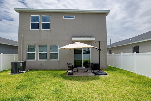 11834 Brighton Knoll Loop, Riverview, FL 33579 - back of house featuring a fenced backyard, stucco siding, and a patio area
