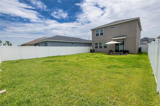11834 Brighton Knoll Loop, Riverview, FL 33579 - rear view of property with stucco siding, a fenced backyard, and a patio area