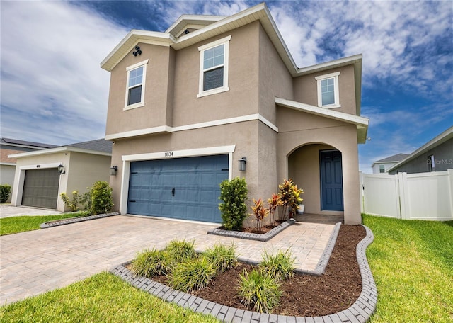 11834 Brighton Knoll Loop, Riverview, FL 33579 - traditional-style house featuring stucco siding, a garage, and driveway