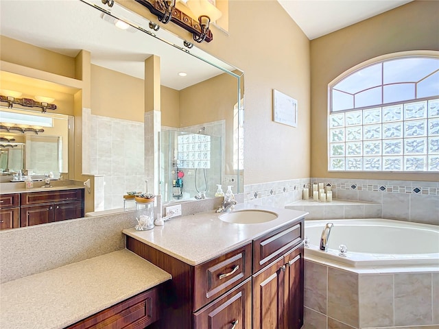 bathroom featuring vanity and plus walk in shower