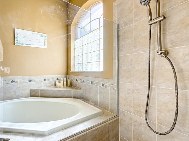 bathroom with shower with separate bathtub