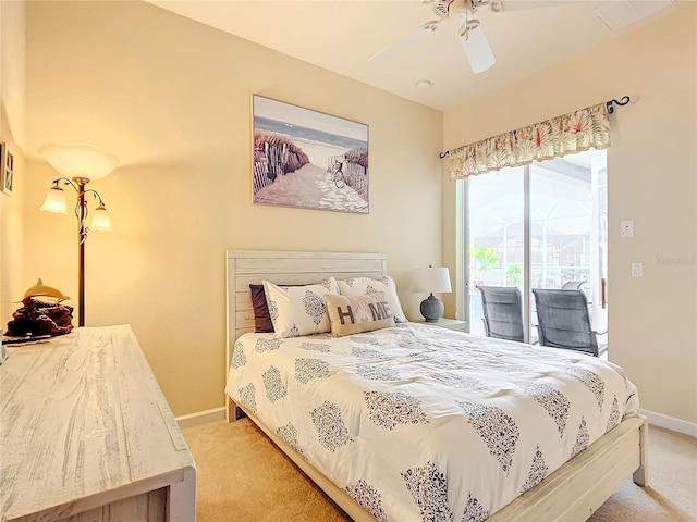 carpeted bedroom with access to exterior and ceiling fan