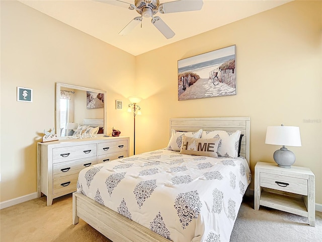 bedroom featuring ceiling fan and light carpet