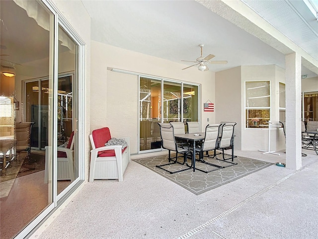 view of patio featuring ceiling fan