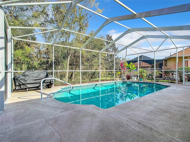 view of pool featuring a lanai and a patio