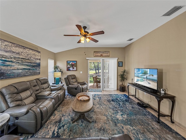 tiled living room featuring ceiling fan and lofted ceiling