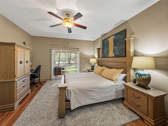 bedroom featuring ceiling fan and dark wood-type flooring